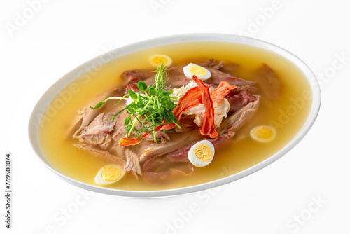 Chicken cholodets. Zalivnoe, a traditional Russian dishon in a white plate. Banquet festive dishes. Gourmet restaurant menu. White background.