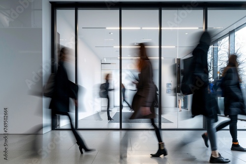 Bright business workplace with people in walking in blurred motion in modern office space