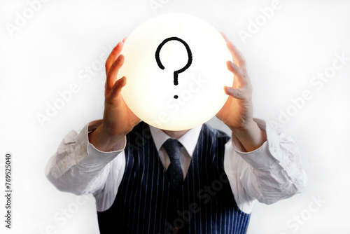 Question mark in a glowing bubble held by a man in shirt and tie