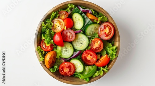 Top view of delicious vegetable salad in a bowl on white background