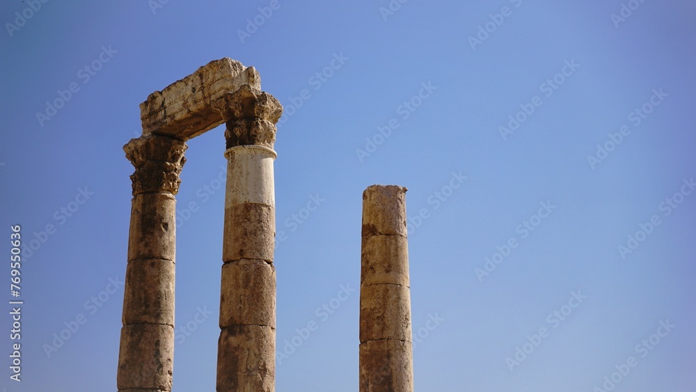 Roman stone columns clustered against the sky
