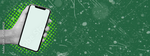 Cell phone with white screen in woman's hand, isolated on green background. Blank space for text.