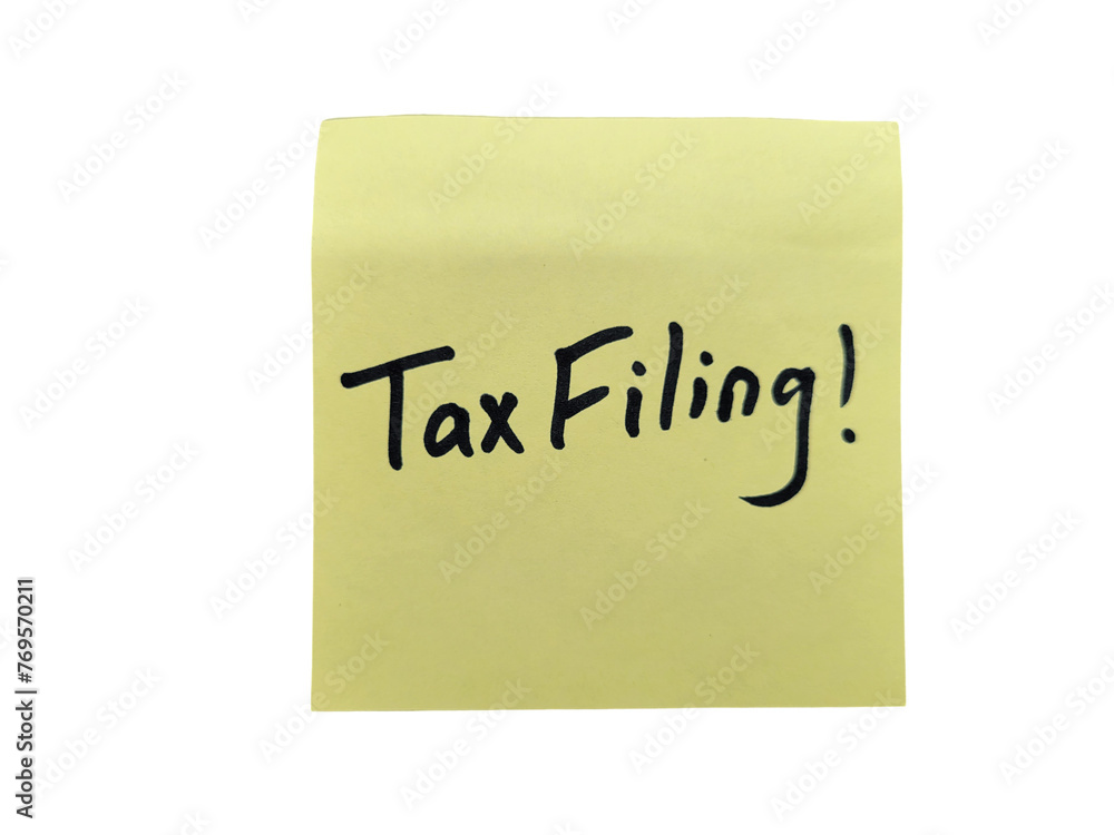 Tax filing on sticky note Tax filing on sticky note