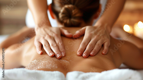 Female massage therapist giving a massage at a spa. AI.
