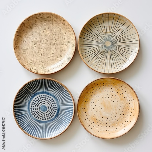 Decorative ceramic painted plate, handmade, isolated, closeup top view.