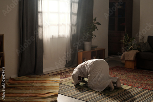 Muslim Man Doing Namaz At Home © pressmaster