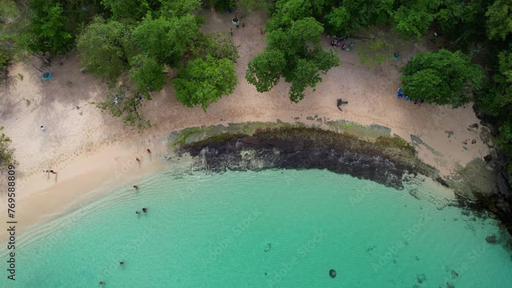 Aerial top down of sandy beach with tourist and clear water during sunny day. Rio San Juan, Dominican Republic. Sargassum in the Caribbean Aerial top down of sandy beach with tourist and clear water during sunny day. Rio San Juan, Dominican Republic. Sargassum in the Caribbean