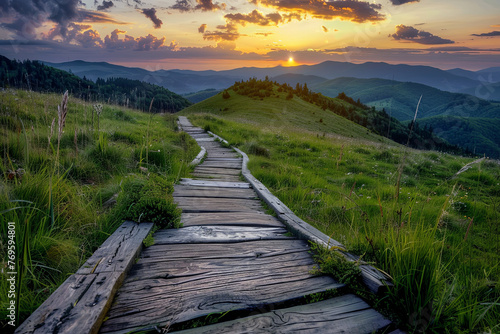 A wooden path through beautiful green hills during sunset