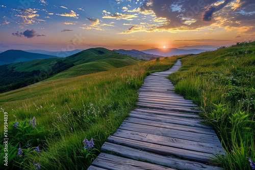 A wooden path through beautiful green hills during sunset