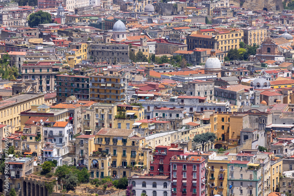 Naples, Italy - June 27, 2021: General aerial view of the city, dense buildings, progressive urbanization of the city. Colorful facades of building