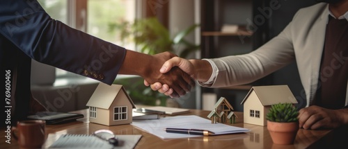 Handshake shared between a real estate agent and client