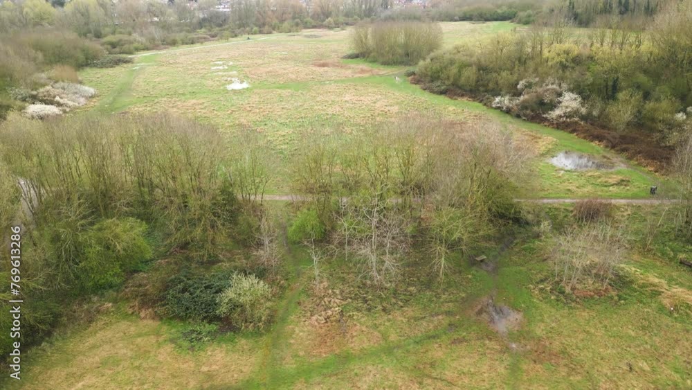 Pedestal drone shot of a marshy area in the Leicester Riverside located in a countryside of United Kingdom. Pedestal drone shot of a marshy area in the Leicester Riverside located in a countryside of United Kingdom.