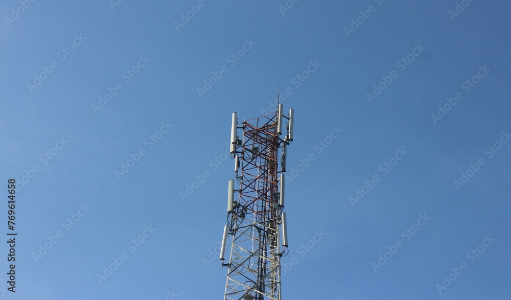 Signal tower on blue sky background. Telecommunication tower Signal tower on blue sky background. Telecommunication tower