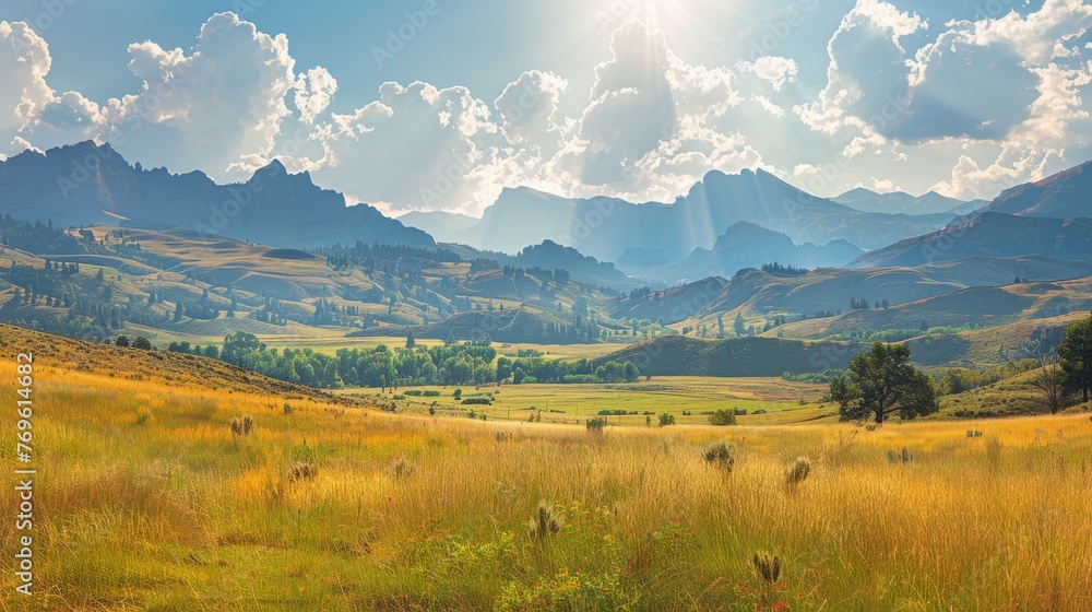 Sunrays Over Golden Meadows and Mountainous Landscape