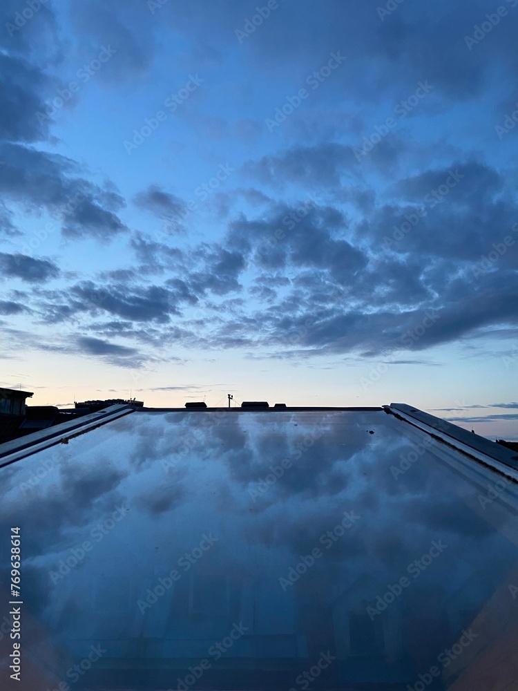 Fototapeta premium clouds over the window glass
