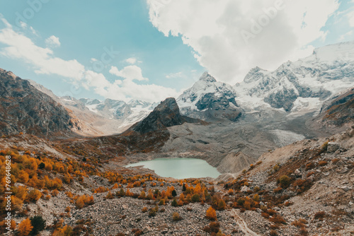 Alpine lake formed due to melting ice, blue lake