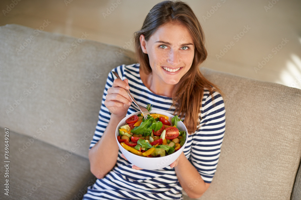 Woman, salad and smile with portrait, diet and health or wellness for weight loss. Lady, living room and organic vegetables with happiness, vegan snack or lunch choice on couch or lounge in house Woman, salad and smile with portrait, diet and health or wellness for weight loss. Lady, living room and organic vegetables with happiness, vegan snack or lunch choice on couch or lounge in house