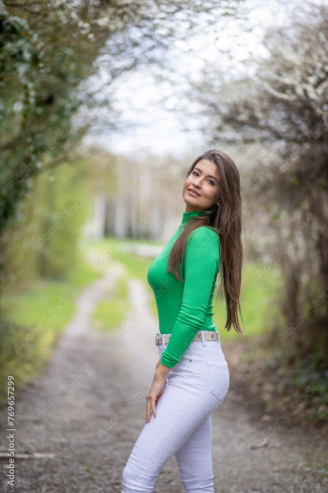 Young Woman in Green Top and White Pants Young Woman in Green Top and White Pants