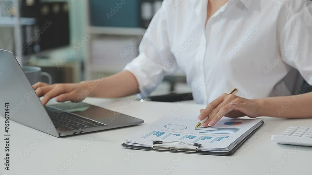 Business woman using calculator for do math finance on wooden desk in office and business working background, tax, accounting, statistics and analytic research concept Business woman using calculator for do math finance on wooden desk in office and business working background, tax, accounting, statistics and analytic research concept