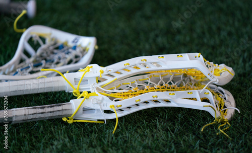 Lacrosse sticks on the game day turf