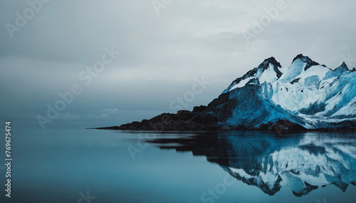 A majestic snow-capped mountain range rising above a serene alpine lake