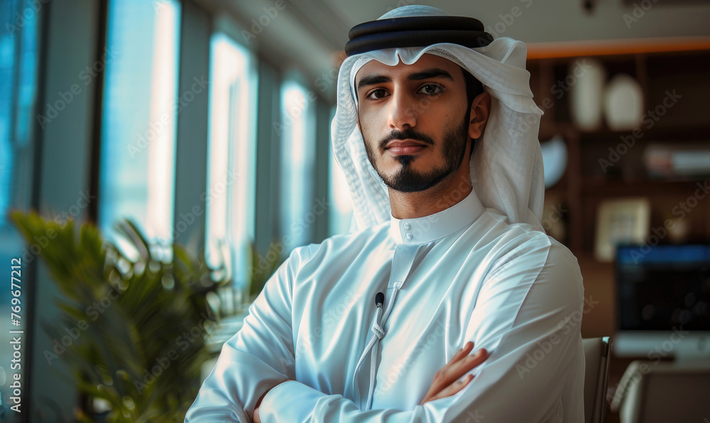 A businessman Emirati young man portrait in his office A businessman Emirati young man portrait in his office