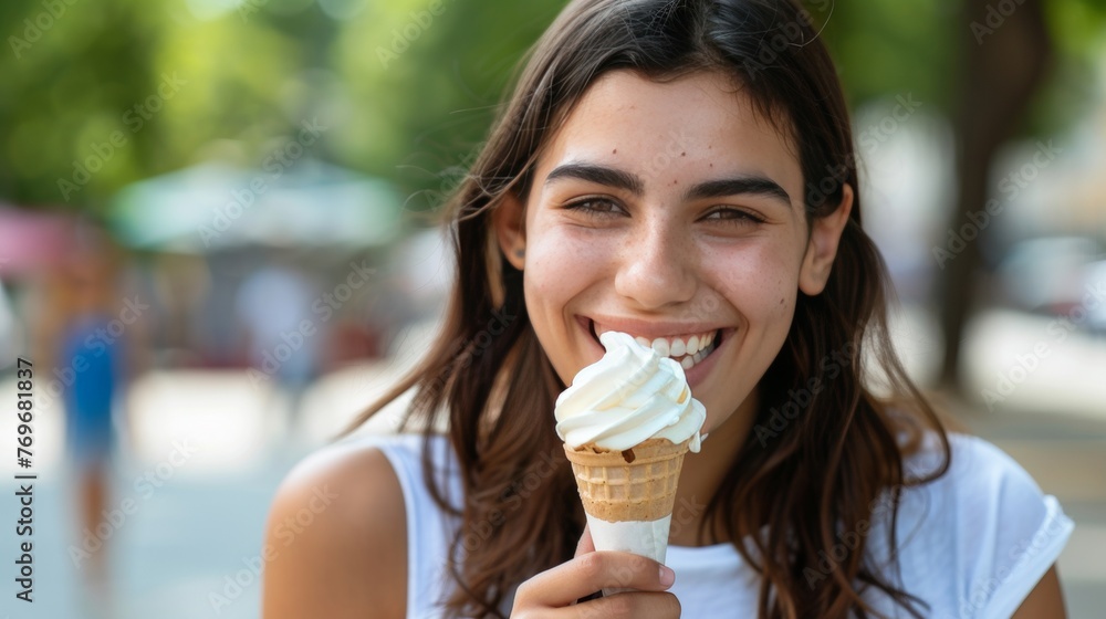 Cheerful woman savoring ice cream in urban park with ample room for text placement Cheerful woman savoring ice cream in urban park with ample room for text placement