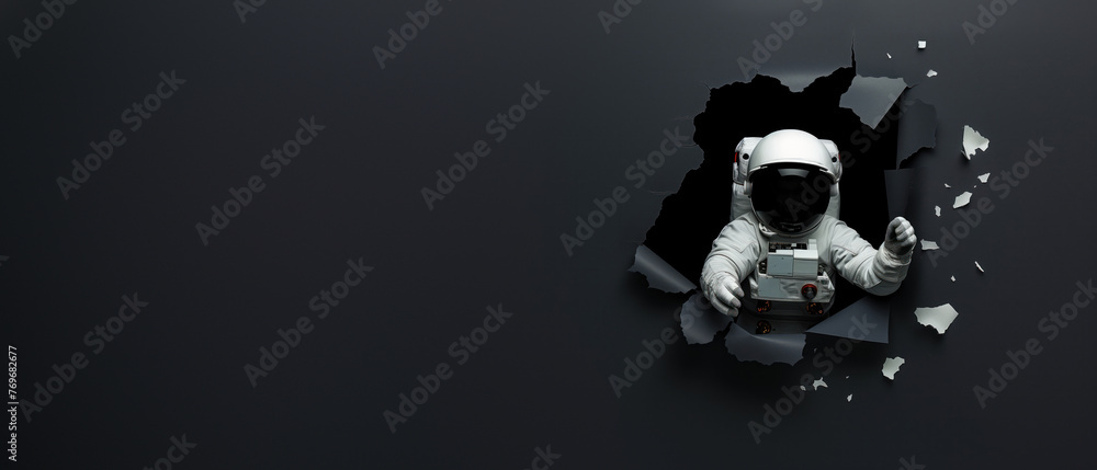 Fototapeta premium An astronaut pierces through a shadowy backdrop with a beam of light, echoing themes of hope and enlightenment