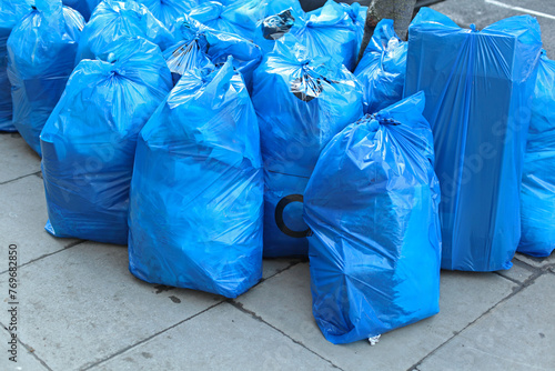 Waste Collection and Recycling Blue Bags at Street in London
