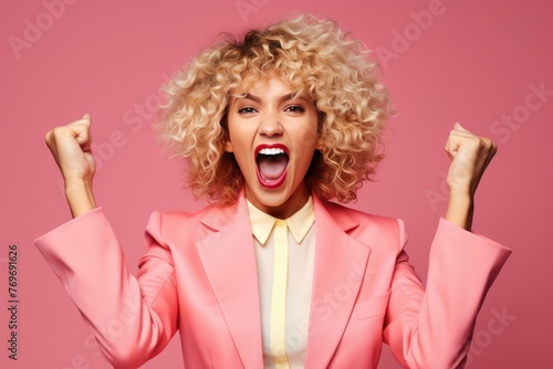 Ecstatic woman shout loud yeah fist up raise win lottery isolated bright shine color background