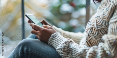 Close-up of someone typing a text message on a smartphone. 