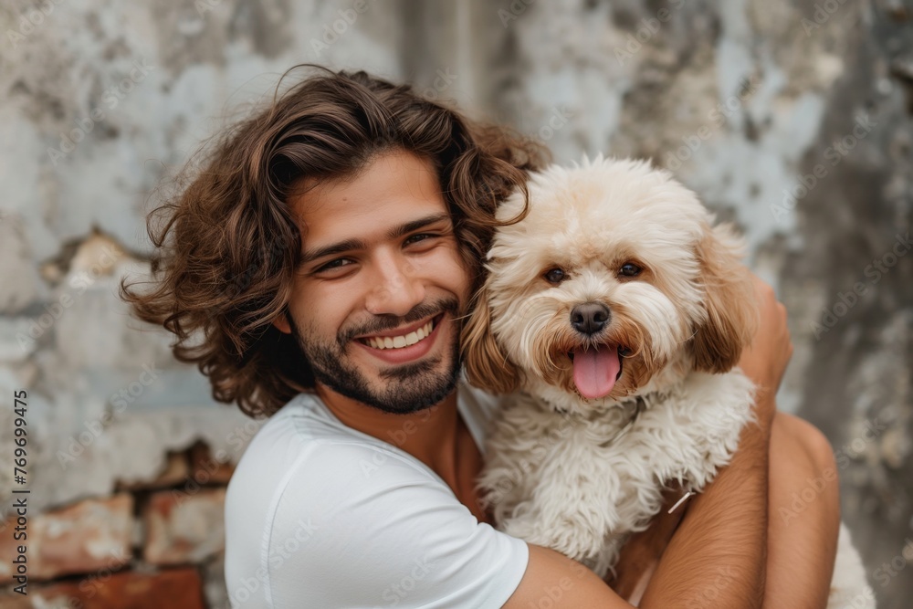 A handsome man with lustrous curly hair grins as he affectionately holds his fluffy, cheerful dog against an urban backdrop. A handsome man with lustrous curly hair grins as he affectionately holds his fluffy, cheerful dog against an urban backdrop.