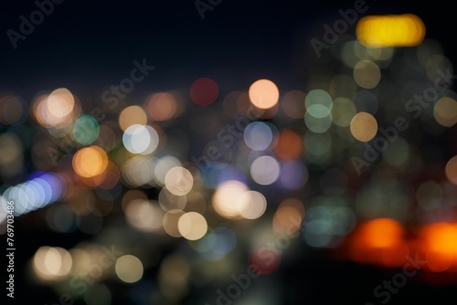 a blurry photo with bokeh effect over the city © Wirestock
