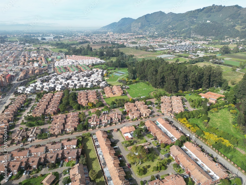 Aerial view of a residential area surrounded by lush greenery. Chia, Cundinamarca, Colombia.