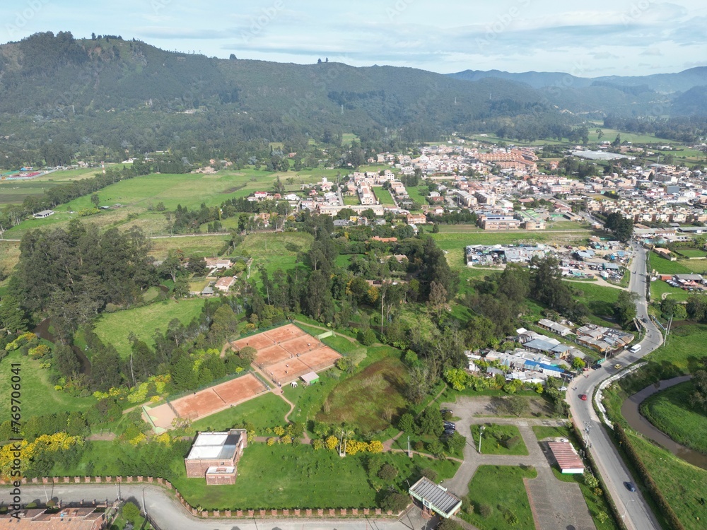Aerial view of tennis courts surrounded by lush greenery. Chia, Cundinamarca, Colombia.