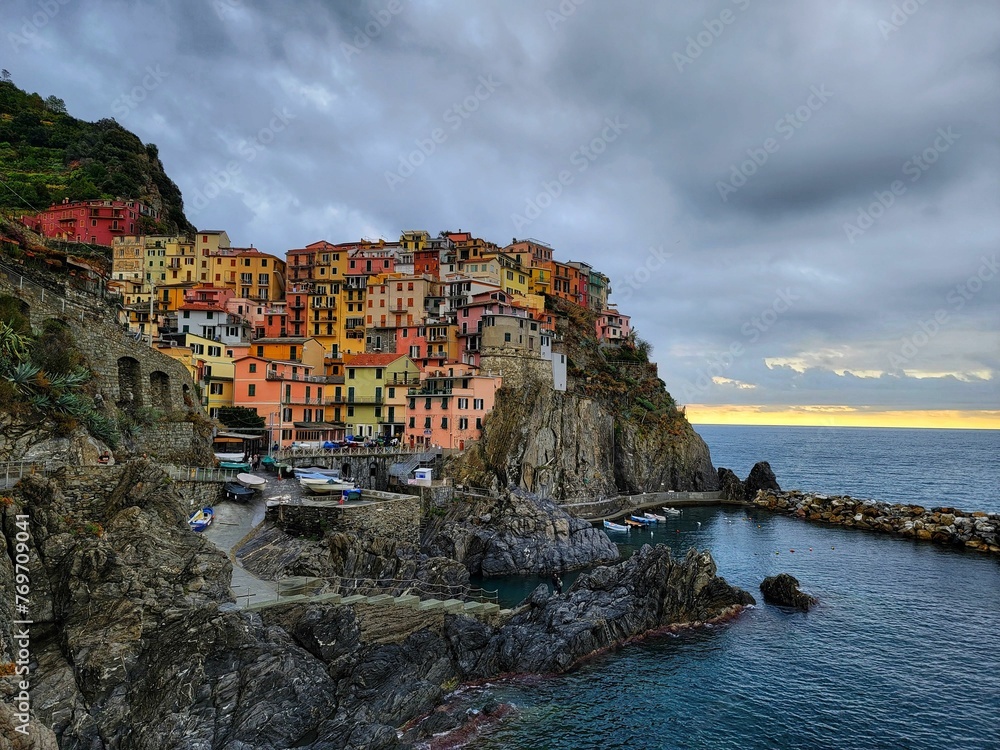 Beautiful view of the colorful coastal village of Cinque Terre, at the edge of the cliff Riomaggiore