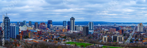 Hamilton Ontario city skyline, downtown buildings, horizon, and the Lake Ontario in the distance in Canada, view from the Niagara Escarpment in Sam Lawrence Park photo