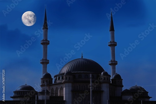 Taksim mosque with a crescent moon in the background. Happy the 27th day of Ramadan or laylat al-qadr. Istanbul, Turkey photo