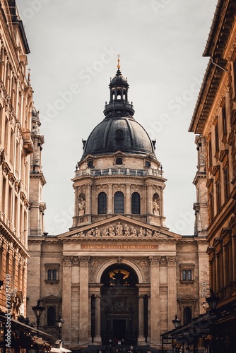 an old building that has some arches in front of it