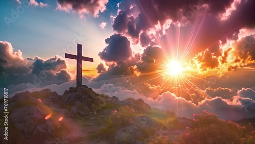 Christian cross in the glow of the sun, mountain landscape above the clouds photo