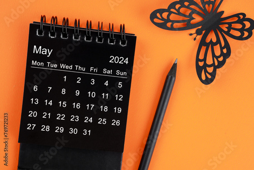 May 2024 desk calendar for the organizer to plan and reminder and butterfly paper.
