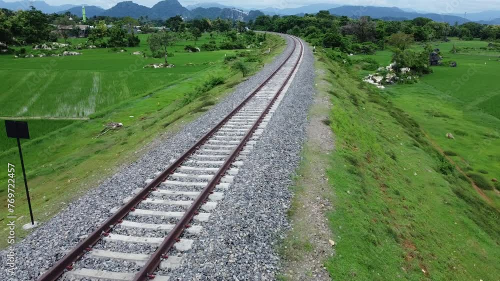 View of railway tracks in rural Indonesia in the afternoon View of railway tracks in rural Indonesia in the afternoon