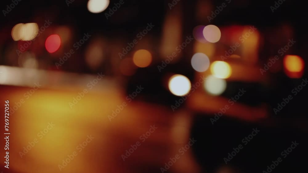 City street defocused lights from traffic at night in Paris City street defocused lights from traffic at night in Paris