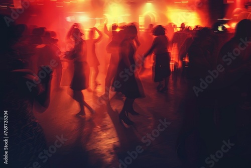 Silhouettes of people dancing in a crowded nightclub, enveloped by pulsating lights, creating an exhilarating atmosphere