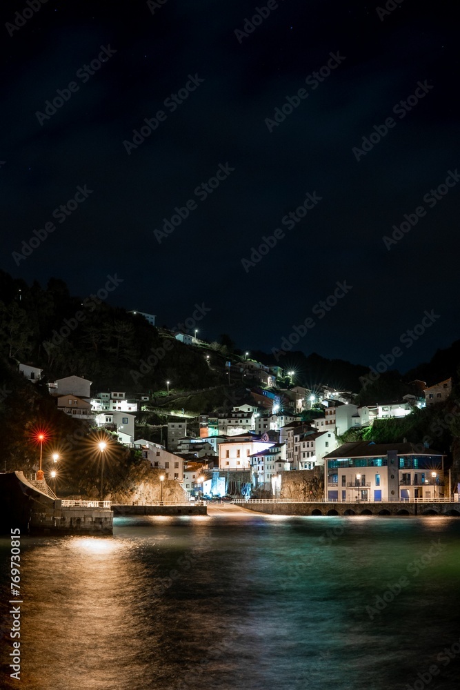Stunning view of a small fishing town located in the North of Spain at night