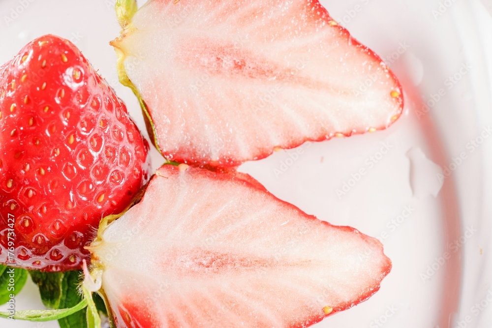 Closeup shot of sliced strawberries with white interior Closeup shot of sliced strawberries with white interior