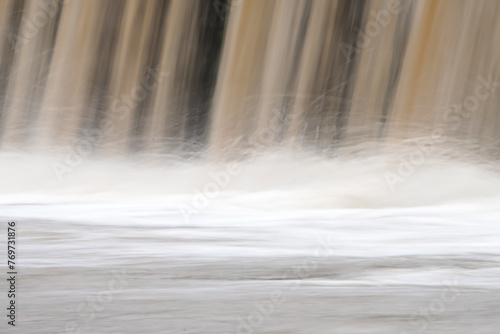 Long exposure photo of waterfall river stream. Natural flowing water theme texture. Empty blank copy text space. photo