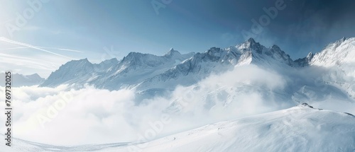 panorama view of cold snowy mountains ranges peaks at altitude landscape covered with clouds at daytime photo
