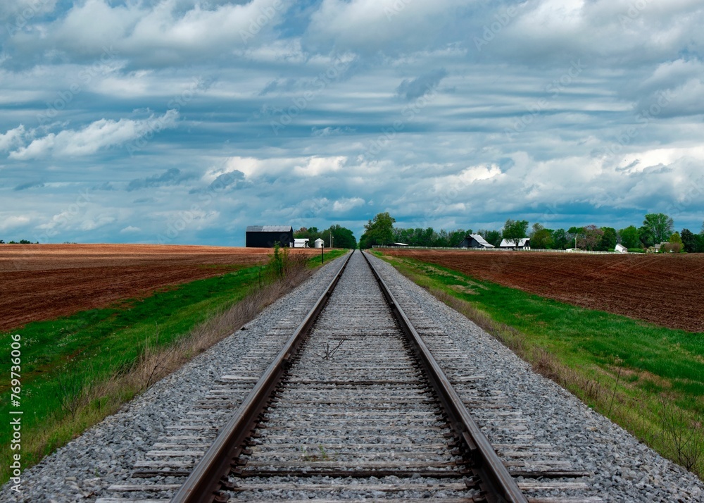 Fototapeta premium Scenic view of railroad tracks in a field in Kentucky