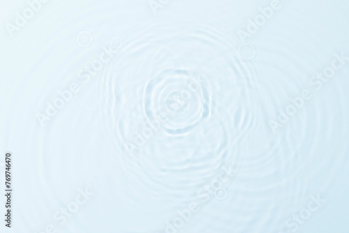 Closeup of pristine and crystal clear water surface background with ripples